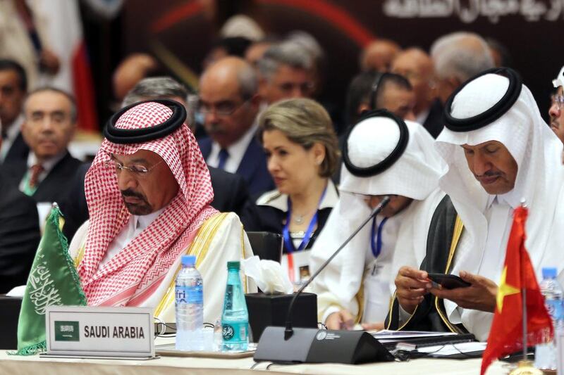 Saudi energy minister Khalid Al Falih, left, attends attends the International Energy Forum in Algiers. Mr Falih said record global stocks of oil had started to decline. Mohamed Messara / EPA