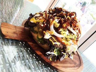 The Jawbreaker measures 20cm and is packed with beef patties, cheese, beef bacon, onions, guacamole and condiments. Courtesy Wavebreak Beach Bar & Grill