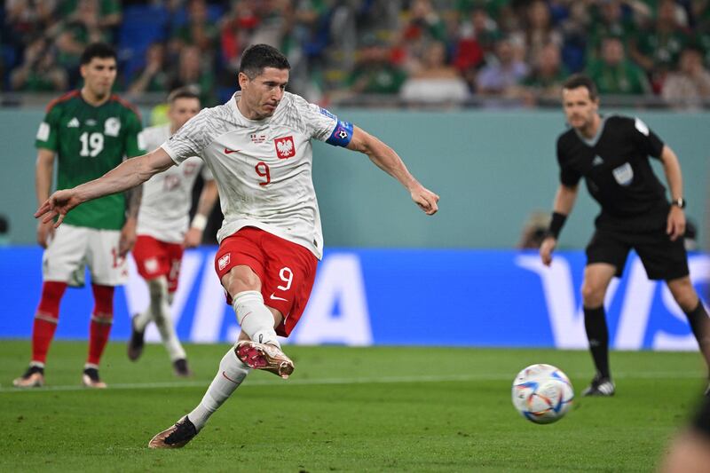 Poland forward Robert Lewandowski misses from the spot. AFP