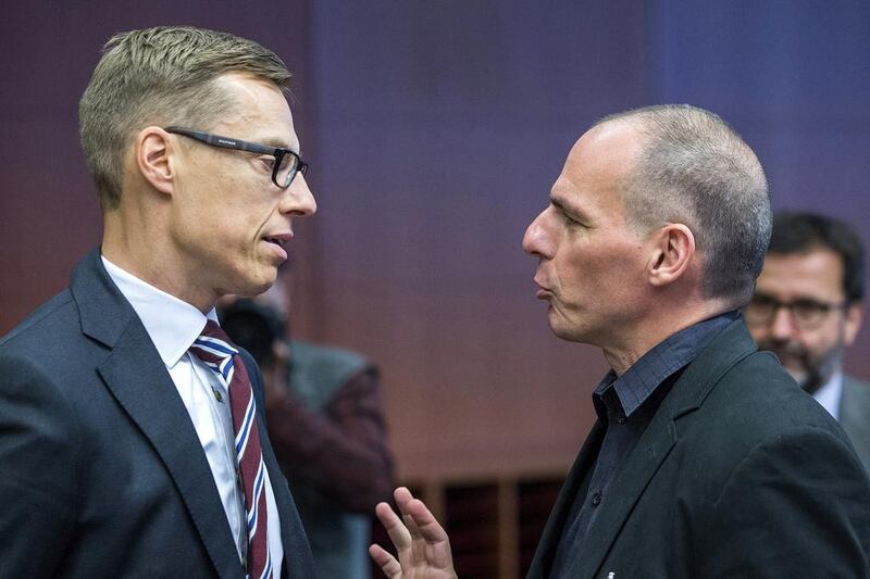 Finnish finance minister Alexander Stubb talks with Yanis Varoufakis during a Eurozone finance ministers emergency meeting on the situation in Greece in Brussels, Belgium on June 27, 2015. Yves Herman / Reuters