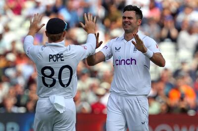 England's Ollie Pope and James Anderson celebrate after taking the wicket of Shubman Gill. AFP