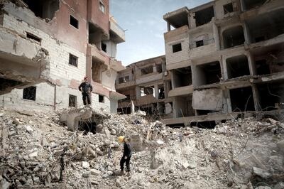 Two firemen in the bombed buildings of Raqqa. David Pratt for The National