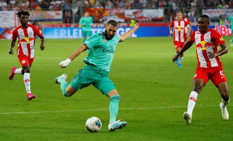 Benzema looks to get a shot away. Reuters
