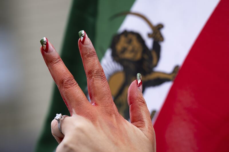 A woman's hand pictured during a freedom rally for Iranian women, in Bern, Switzerland.  EPA 