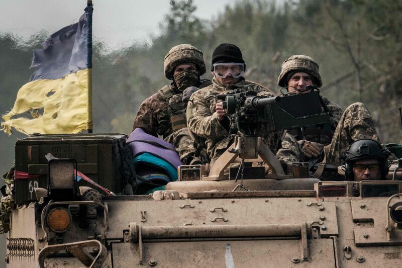 Ukrainian servicemen near the recently retaken town of Lyman in Donetsk region. AFP