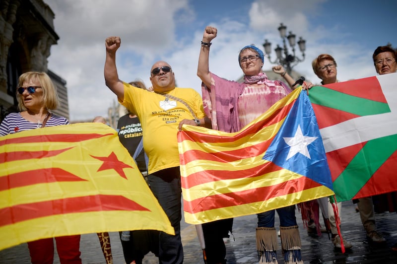 Protesters carry Esteladas, Catalan separatist flags, and Basque flags, during a rally in favour of a referendum on independence from Spain for the autonomous community of Catalonia, in the Basque city of Bilbao, Spain September 9, 2017. REUTERS/Vincent West