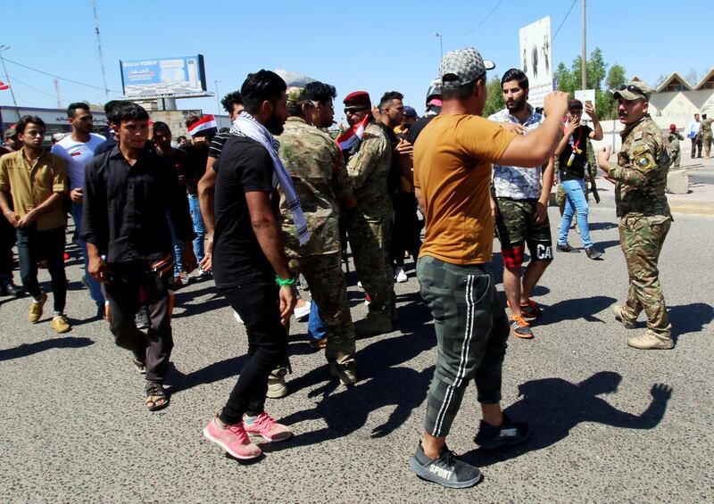 Iraqi demonstrators gather during an anti-government protest in front of the Governorate building in Basra, Iraq.  Reuters