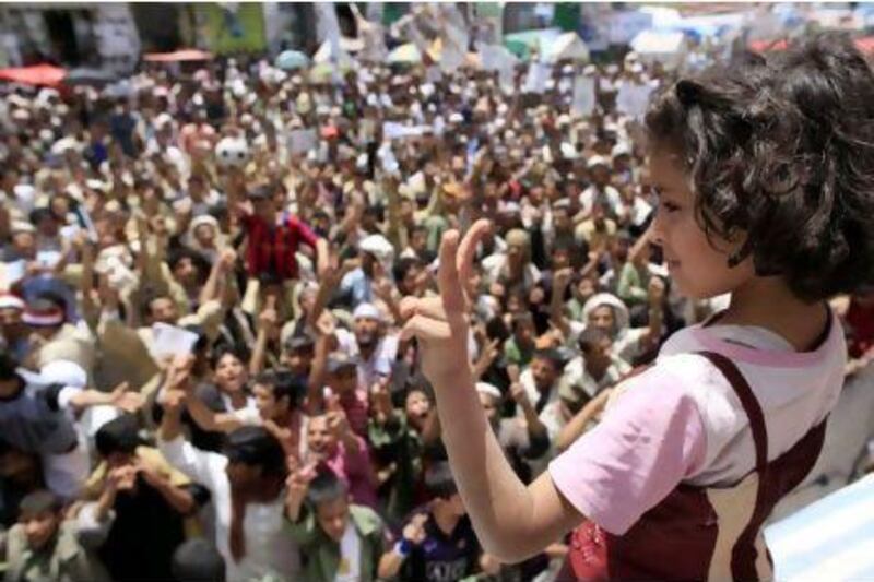 A girl makes her feelings plain about victory for the protesters during an anti-government rally to demand the ousting of Yemen's President Ali Abdullah Saleh in Sanaa yesterday. Ahmed Jadallah / Reuters