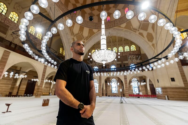 UFC fighter Muhammad Mokaev takes time out from training to pray at Al Fateh Grand Mosque in Manama, Bahrain. 