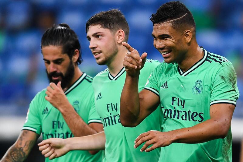 Casemiro celebrates with Isco and Federico Valverde. Getty