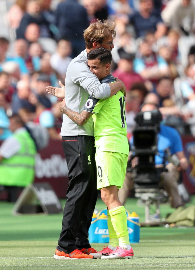 File photo dated 14-05-2017 of Liverpool manager Jurgen Klopp (left) embraces Philippe Coutinho PRESS ASSOCIATION Photo. Issue date: Monday July 31, 2017. Liverpool manager Jurgen Klopp has reiterated his stance Barcelona target Philippe Coutinho is not for sale. See PA story SOCCER Liverpool. Photo credit should read Adam Davy/PA Wire.