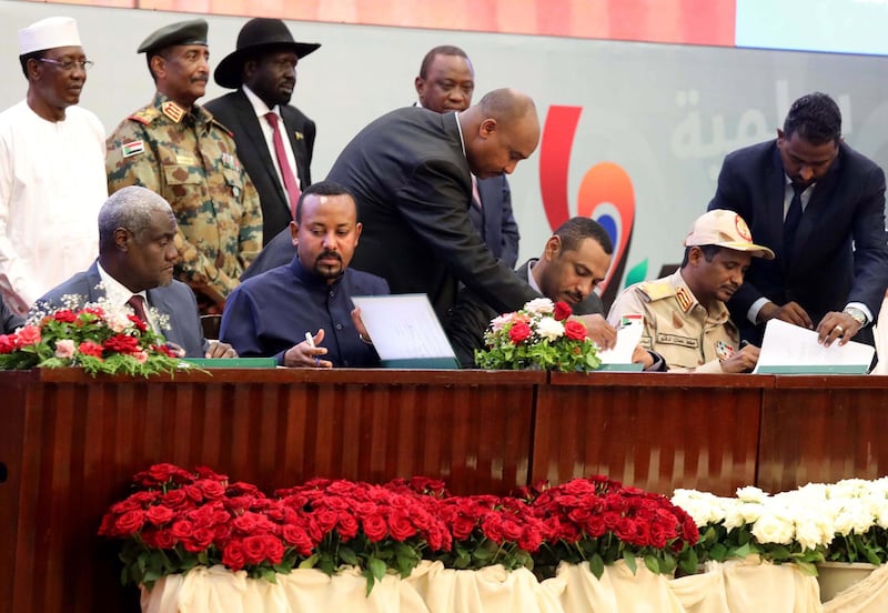 Sudan's Forces of Freedom and Change coalition leader Ahmad Rabiah (3-R) and Sudan's General and Vice President of Sudanese Transitional Military Council, Mohamed Hamdan Dagalo (2-R) sign power-sharing agreement,. EPA