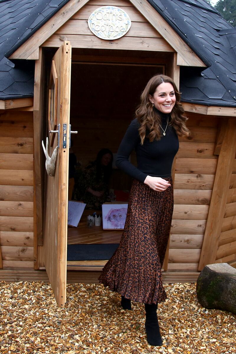 Catherine, Duchess of Cambridge, in a Zara leopard print skirt and Massimo Dutti turtleneck, arrives at Ely and Caerau Children’s Centre in Cardiff, Wales, on January 22, 2020. Getty Images