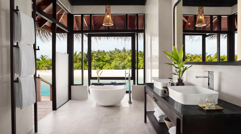 Floor-to-ceiling windows and doors allow guests to make the most of ocean and shoreline views