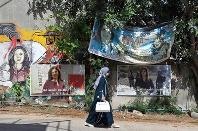 A woman walks past the spot where US-Palestinian journalist Shireen Abu Akleh was killed on May 11 last year while covering an Israeli raid in the occupied West Bank. AFP