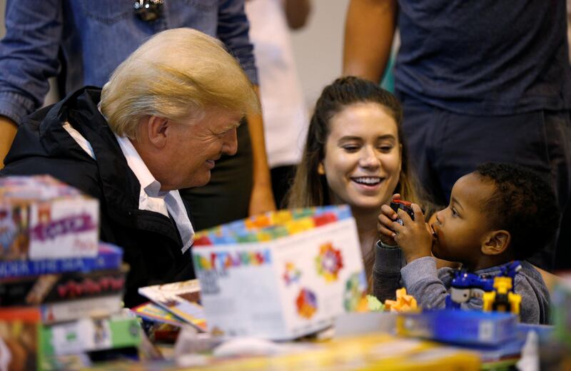 U.S. President Donald Trump visits with survivors of Hurricane Harvey at a relief center in Houston, Texas, U.S., September 2, 2017. REUTERS/Kevin Lamarque