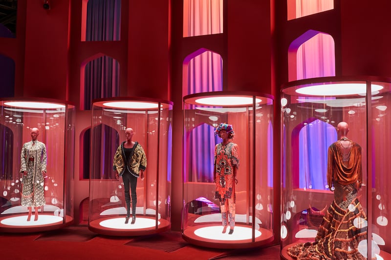 Ensembles by Zandra Rhodes (left and centre) and Jean Paul Gaultier (right) 