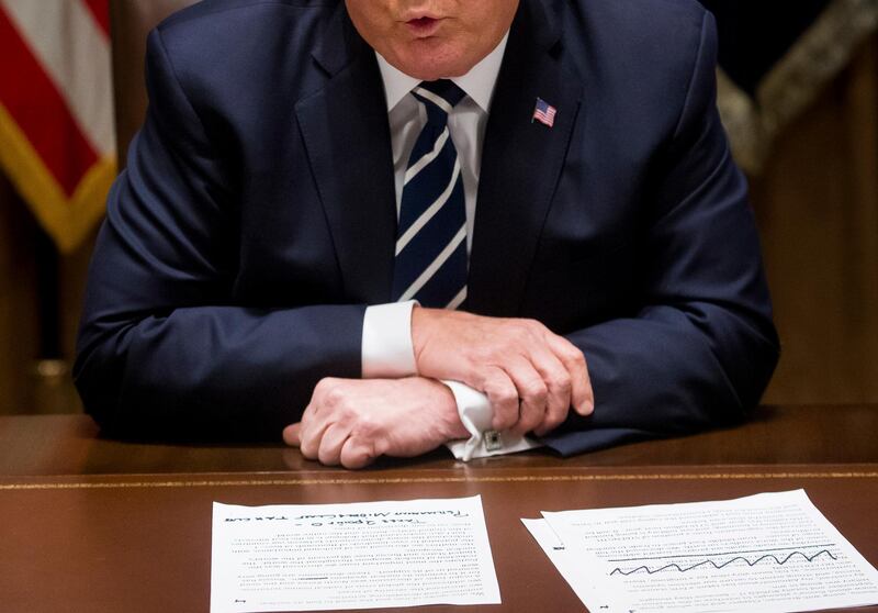 Notes are seen in front of US President Donald Trump while delivering remarks on Russia in the Cabinet Room of the White House in Washington. EPA