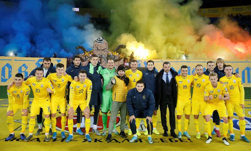 Ukraine coach Andriy Shevchenko and players celebrate at the end of the match. Ukraine beat Lithuania 2-0, leaving them needing a point to qualify for Euro 2020. Reuters