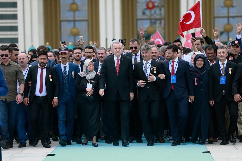 Turkish President Recep Tayyip Erdogan (C) visiting Martyrs Memorial on the third anniversary of the failed coup attempt at the Presidential Palace in Ankara, Turkey.  EPA