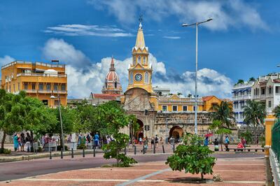 orange Torre del Reloj and Plaza de la Paz, Cartagena de Indias, Colombia, South America. Getty Images