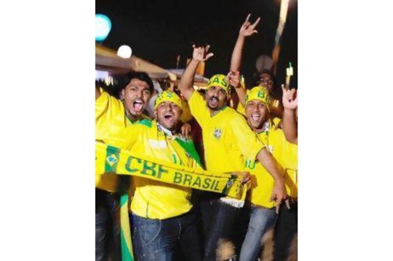 Brazil fans enjoy the party vibe as they get ready for a friendly with England in Doha.