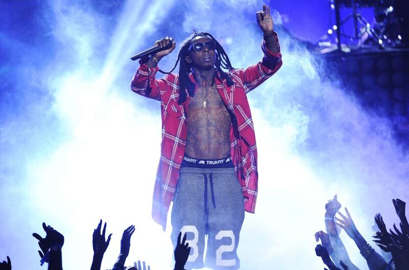 Lil’ Wayne performs at the BET Awards at the Nokia Theatre on Sunday, June 29, 2014, in Los Angeles. Chris Pizzello / Invision / AP