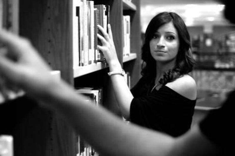 Picture 8: Production snapshot of Library Girl played by Reena Sadek, an American/Palestinian business student who plays the muse in the film Moments of Fiction.
 Courtesy  M.M. Productions
