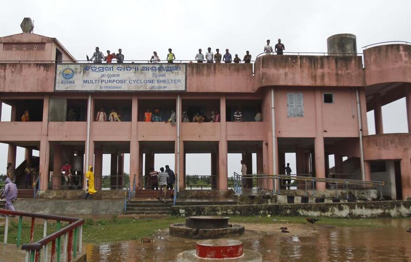 Villagers take refuge in a cyclone shelter at Gokhorkuda village. AP Photo/Biswaranjan Rout