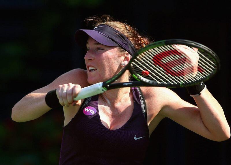 Madison Brengle of the USA hits a shot against  Ekaterna Makarova of Russia during day one of the WTA Dubai Duty Free Tennis Championship at the Dubai Duty Free Stadium on February 15, 2016 in Dubai, United Arab Emirates.  (Photo by Francois Nel/Getty Images)