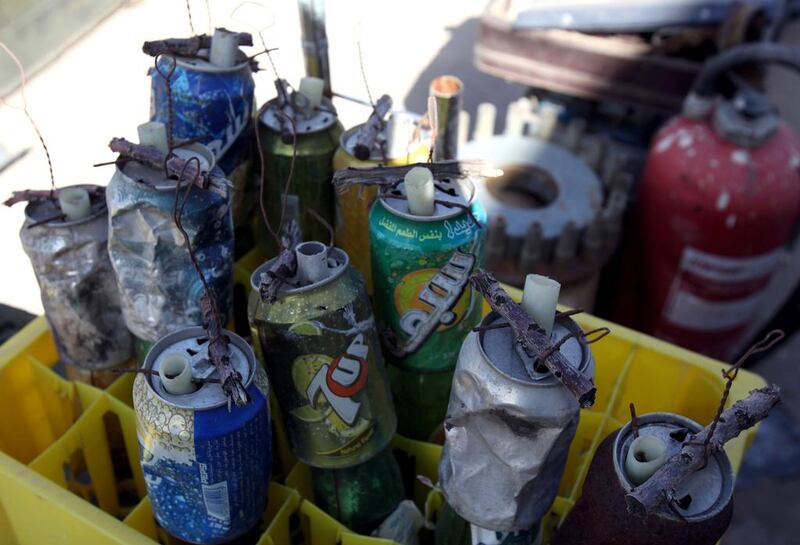 Grenades made from drink cans, which were used against Muammar Qaddafi’s forces during the Libyan uprising, are displayed. Larger, more sophisticated weapons such as Soviet-made anti-aircraft missiles have also been collected. Mahmud Turkia / AFP Photo