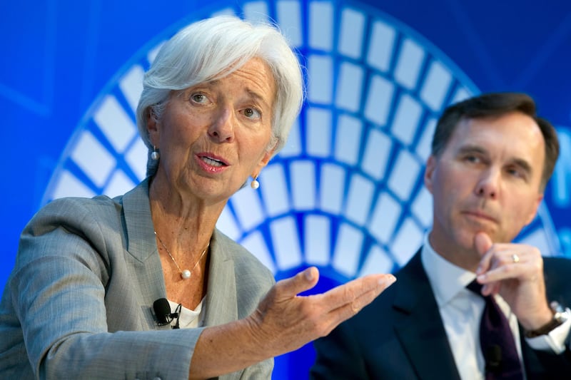 International Monetary Fund (IMF) Managing Director Christine Lagarde accompanied by Canada Finance Minister William Morneau, speaks during a Global Economy debate in the sidelines of the World Bank/IMF Annual Meetings in Washington, Thursday, Oct. 12, 2017. ( AP Photo/Jose Luis Magana)