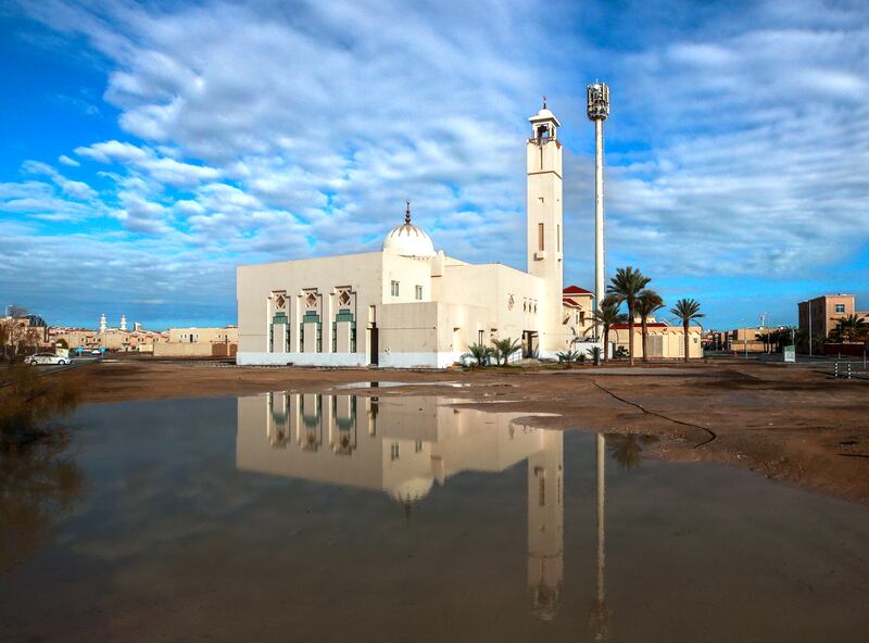 Floodwaters rise near a mosque in Khalifa City, Abu Dhabi. Victor Besa / The National