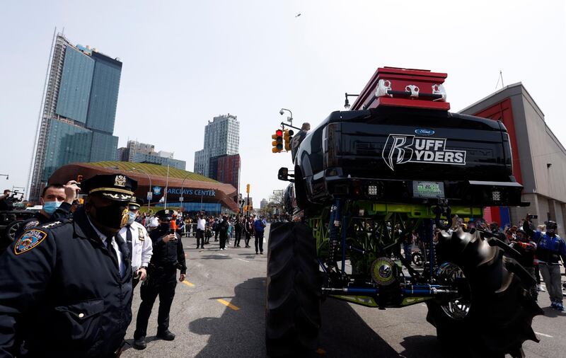 Members of the NYPD stand next to the monster truck holding the casket of US rapper DMX. EPA