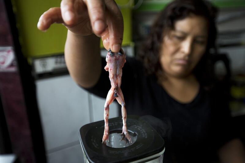 To make the mix, which is sold in Peru’s Andes and also at some stands in its capital Lima, vendor Maria Elena Cruz grabs a frog from a small aquarium then kills it by beating it on the counter of her stand.