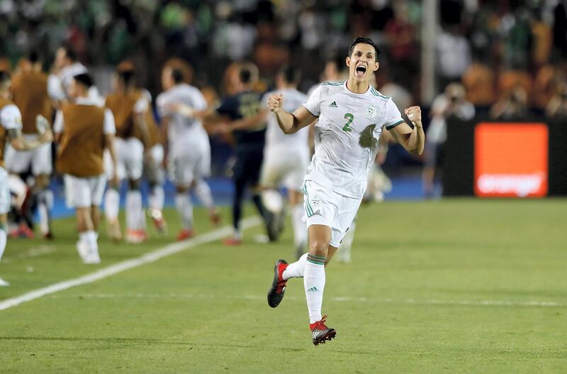Algeria's defender Aissa Mandi celebrates his team's win during the 2019 Africa Cup of Nations (CAN) Semi-final football match between Algeria and Nigeria at the Cairo International stadium in Cairo on July 14, 2019. (Photo by FADEL SENNA / AFP)