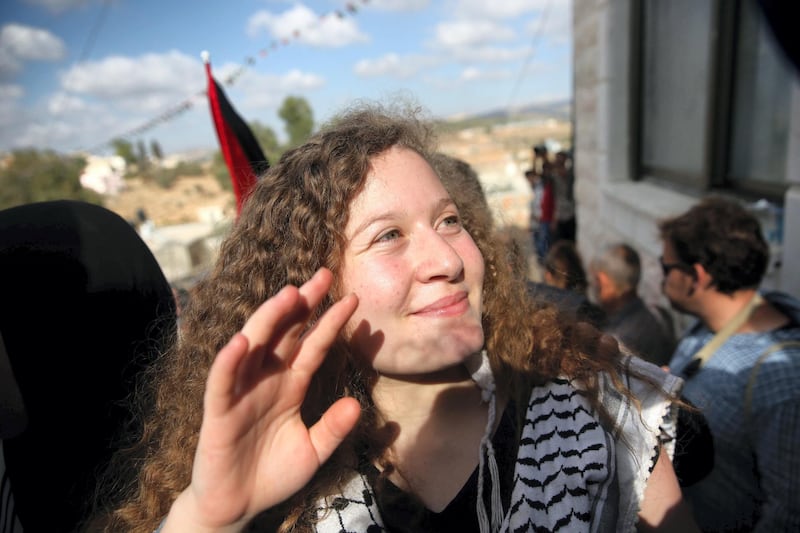 Ahed waves as she returns to Nabi Saleh.