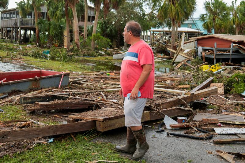Buddy Ellison, 39, surveys his now destroyed shrimping business after Hurricane Idalia. Reuters