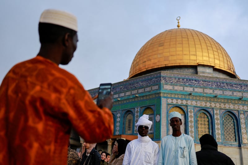 Muslims take photographs at Al Aqsa Mosque in Jerusalem. Reuters