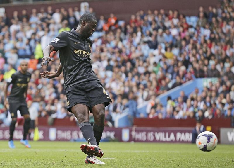 Yaya Toure's move from Barcelona to Manchester City has hit off. Malcolm Couzens / AP Photo