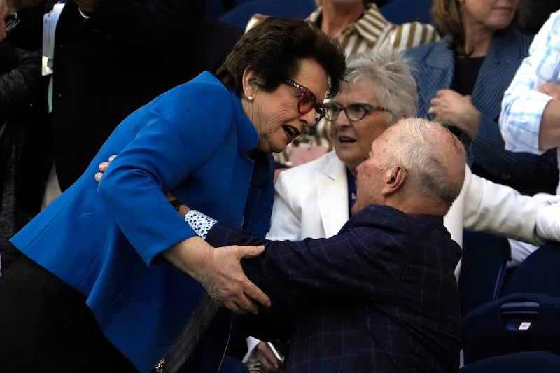 Billie Jean-King is greeted as she arrives on Rod Laver Arena for the semi-final between Victoria Azarenka and Elena Rybakina. AP