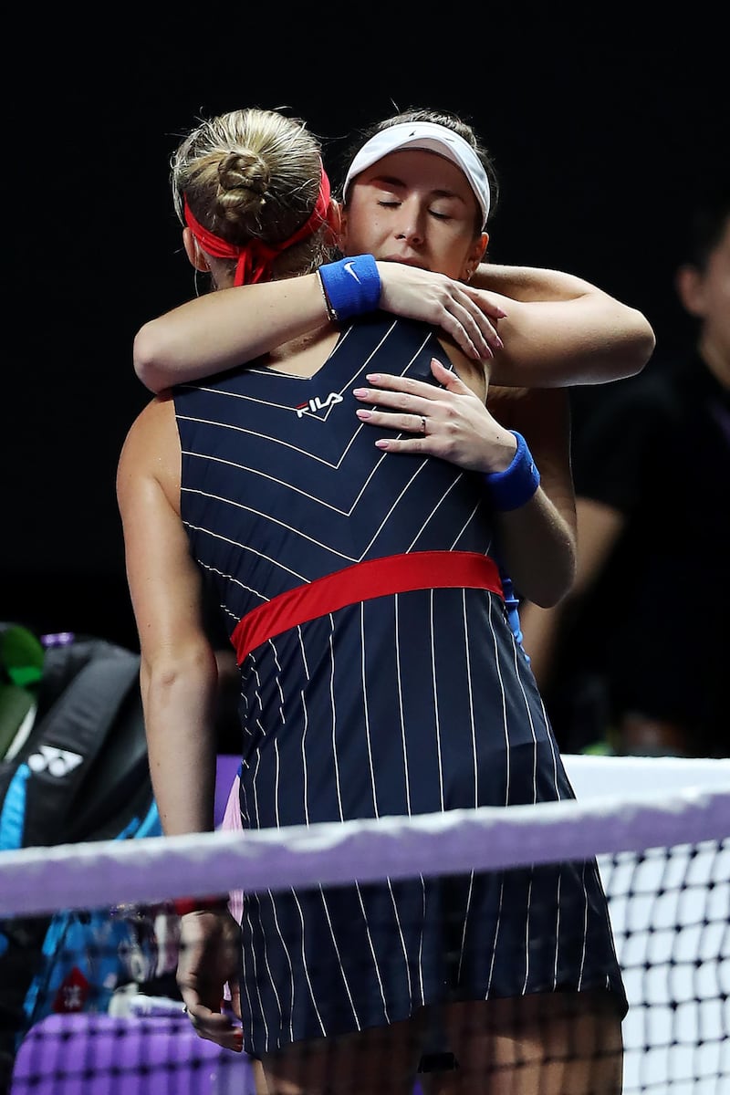 Kiki Bertens is consoled by Belinda Bencic of Switzerland after her withdrawal from their WTA Finals match at the Shenzhen Bay Sports Center. Getty Images