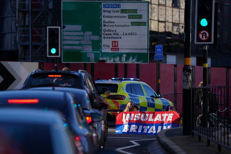 Insulate Britain protesters block Great Charles Street Queensway in Birmingham. The protesters have spread across the UK, with Birmingham and Manchester targeted in addition to London.