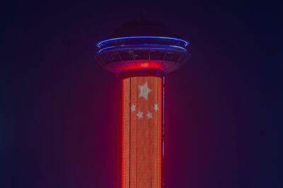Abu Dhabi, United Arab Emirates - July 22, 2019: AThe tower at Marina Mall is lit up with the Chinese flag to celebrate Sheikh Mohamed bin Zayed's visit to China. Monday the 22nd of July 2019. Corniche, Abu Dhabi. Chris Whiteoak / The National