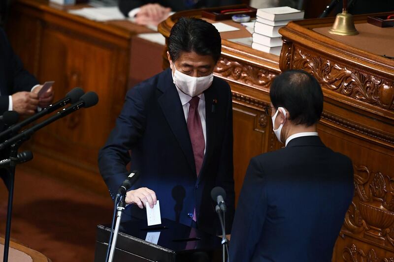 Japan's outgoing Prime Minister Shinzo Abe casts his ballot to elect new prime minister.  AFP