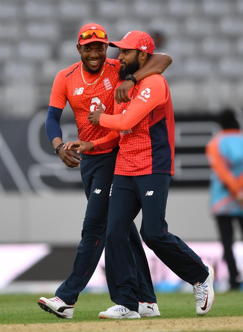 AUCKLAND, NEW ZEALAND - NOVEMBER 10: Chris Jordan of England celebrates with Adil Rashid after winning game five of the Twenty20 International series between New Zealand and England at Eden Park on November 10, 2019 in Auckland, New Zealand. (Photo by Gareth Copley/Getty Images)