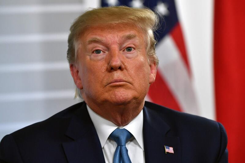 US President Donald Trump looks on during a bilateral meeting with Japan's Prime Minister at the Bellevue centre in Biarritz, south-west France on August 25, 2019, on the second day of the annual G7 Summit attended by the leaders of the world's seven richest democracies, Britain, Canada, France, Germany, Italy, Japan and the United States. / AFP / Nicholas Kamm
