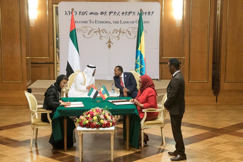 ADDIS ABABA, ETHIOPIA - June 15, 2018: HH Sheikh Mohamed bin Zayed Al Nahyan, Crown Prince of Abu Dhabi and Deputy Supreme Commander of the UAE Armed Forces (centre L) and HE Abiy Ahmed (centre R), witness an MOU signing ceremony held at Jubilee Palace. Seen signing is HE Noura Mohamed Al Kaabi, UAE Minister of Culture and Knowledge Development (L).
( Mohamed Al Hammadi / Crown Prince Court - Abu Dhabi )
---