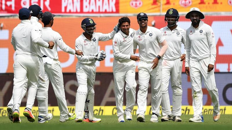 Kuldeep Yadav, centre, made an impressive Test debut against Australia at Dharamshala earlier this year. Prakash Singh / AFP