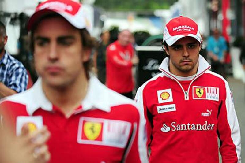 Fernando Alonso, left, can still win the championship but Felipe Massa's tilt is all but over.